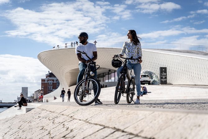 Belém E-Bike Guided Tour Explore Lisbon by the river - Downriver stops: the 25th of April Bridge and the MAAT contrast