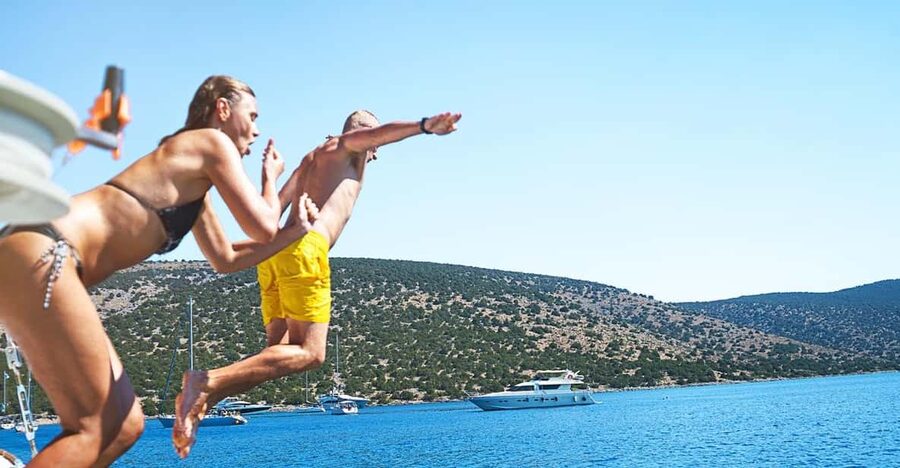 Boat Party to the Beach with Swimming Stops, DJ and Open Bar - The Onboard Vibe: DJ Music, Open Bar, and Real Social Energy