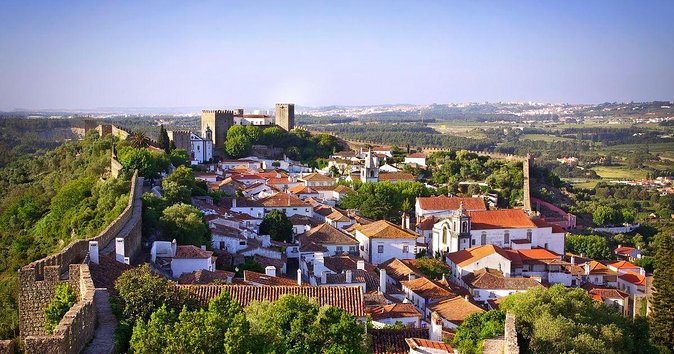 From Lisbon: Fátima, Nazaré, Batalha, and Óbidos Guided Tour - Óbidos medieval walls and ginjinha: what 1 hour really buys you