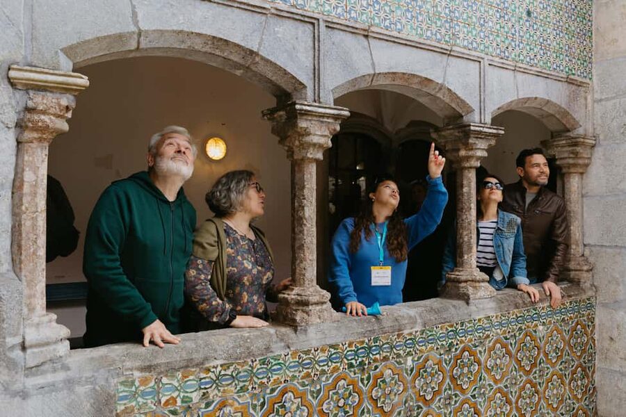 From Lisbon: Sintra, Regaleira and Pena Palace Guided Tour - Quinta da Regaleira: Gardens, Lakes, Grottoes, and the Initiation Well