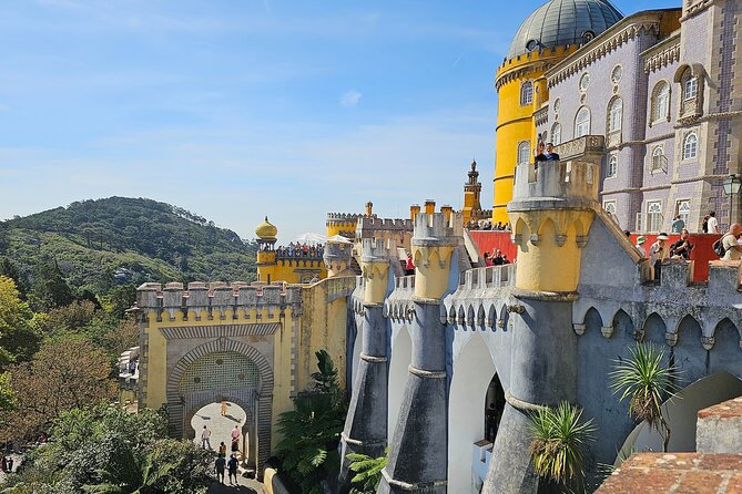Group Tour to Sintra, Pena, Regaleira, Cabo da Roca & Cascais - Pena Palace: fairy-tale color, hilltop drama, and ticket reality