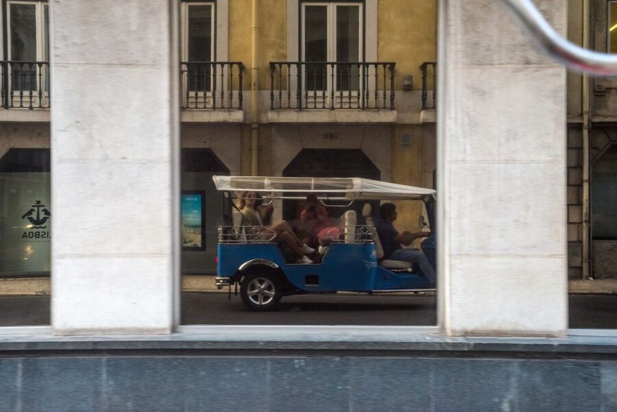 Lisbon by Tuk Tuk Guided Tour: City of Neighborhoods - Passing Sé de Lisboa and Reading the Castelo de S. Jorge Walls