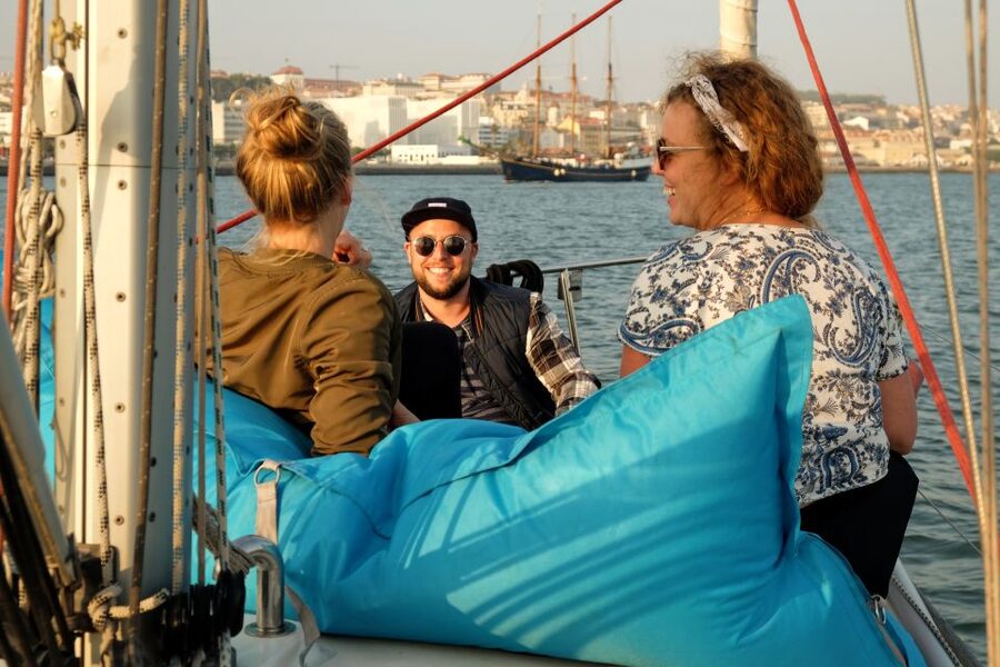Lisbon: City Skyline Sailboat Cruise with Drink and Snacks - Belém Side Passing: Defensive Fortifications and Major Landmarks