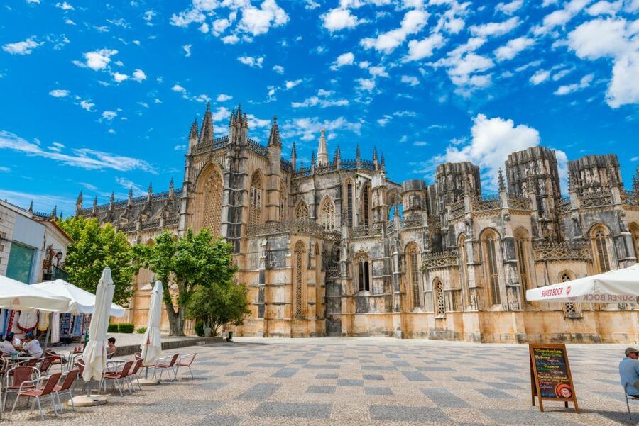 Lisbon: Fatima, Batalha, Nazare and Obidos Tour Hotel Pickup - Óbidos: medieval lanes, castle walls, and ginjinha in a wedding-present town