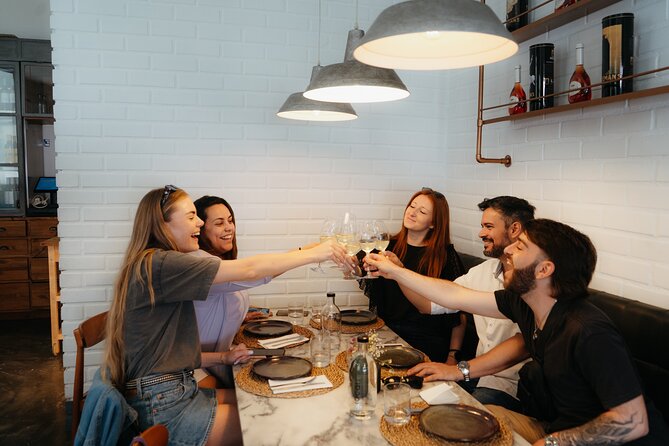 Lisbon Food & Tuk Tuk Tour with Eating Europe - Alfama’s Alpendre: cheese board, vegetable soup, and sparkling green wine