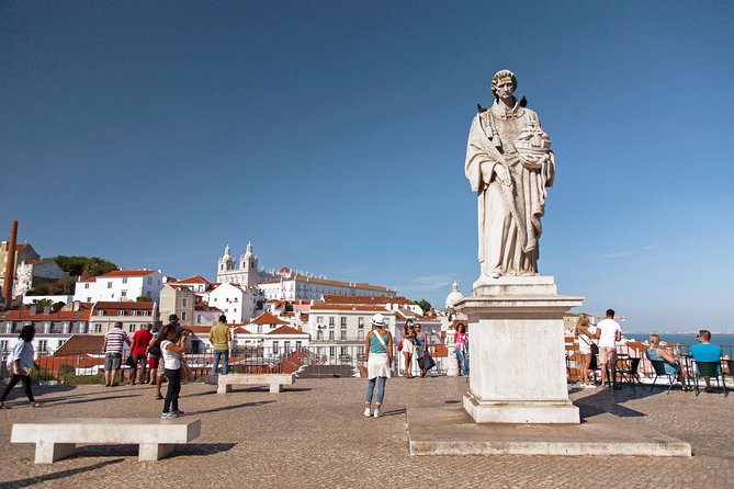 Lisbon Highlights - Private Tour with Van and Local Guide - Lisbon Cathedral and Praça do Comércio, shifting from old stone to grand squares