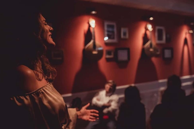 Lisbon: Live Fado Show with Port Wine in Historic Center - The multimedia introductions: Fado history in English with Portuguese subtitles