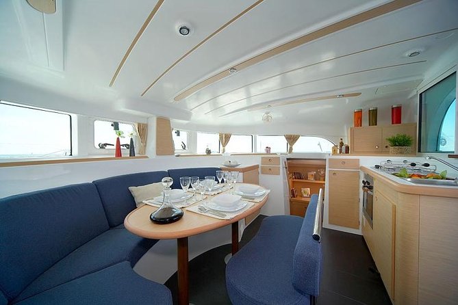 Lisbon Sailing Catamaran Public Cruise with drinks - 25 de Abril Bridge and Cristo Rei: engineering plus a real faith promise