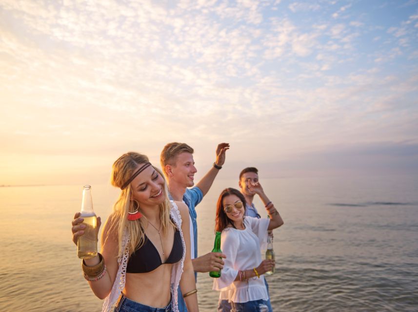 Lisbon: Sunset Boat Party Cruise with DJ and Open Bar - Where You’ll Board and Drop Off on Lisbon’s Riverfront