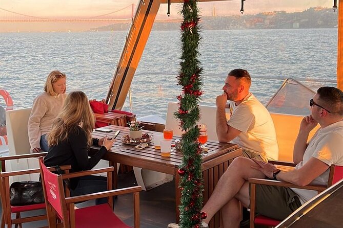 Lisbon : Sunset Catamaran Boat Tour with Music and Drinks - Between river icons: the medical research foundation glide-by