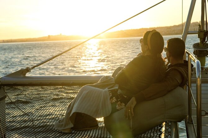 Lisbon : Sunset Catamaran Boat Tour with Music and Drinks - Belém Tower: defense history seen at sunset speed