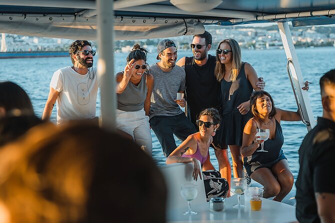 Lisbon : Sunset Catamaran Boat Tour with Music and Drinks - Music, welcome drinks, and the real party level on board