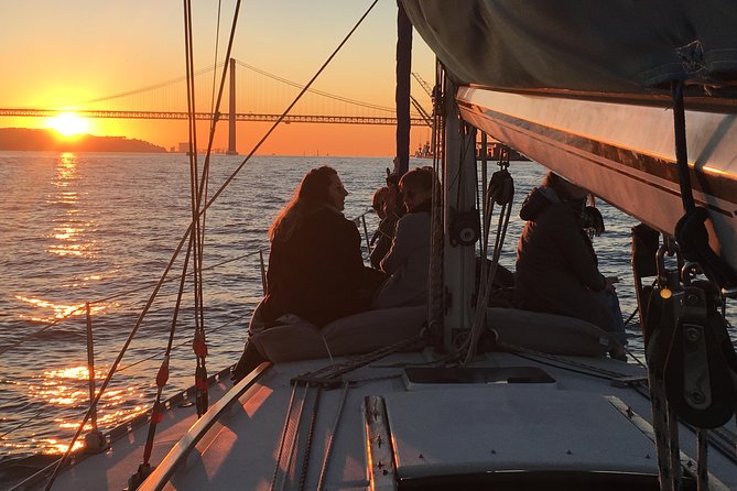 Lisbon Sunset Sailing Tour with White or Rosé Wine and Snacks - Setting Sail Under Ponte 25 de Abril and Almada’s Skyline