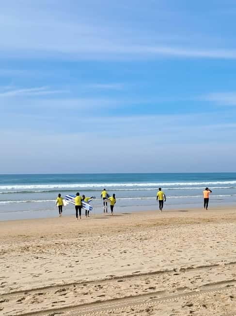 Lisbon: Surfing Lesson on Costa de Caparica Beach - Before the waves: wetsuit, sand basics, and the safety briefing you will appreciate