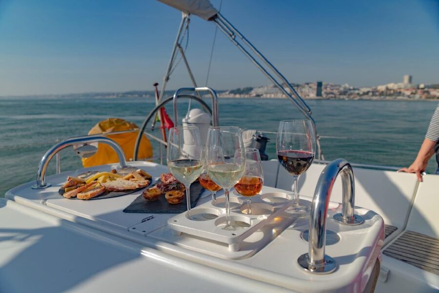 Lisbon: Tagus River Sailboat Tour - The welcome drink and Portuguese snacks: the sunset part you can taste