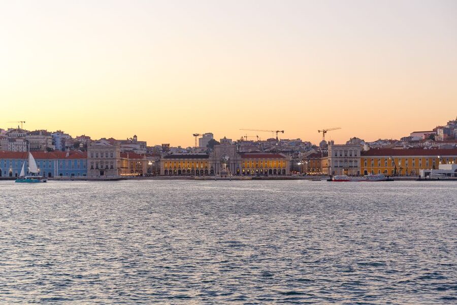 Lisbon: Tagus River Sunset Tour with Snacks and Drink - Golden Hour Route: Commerce Square to Alfama’s colorful buildings