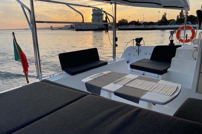 LUXURY Catamaran Sunset and Wine cruise - Crossing toward the south bank: Cacilhas, restaurants lights, and Cristo Rei